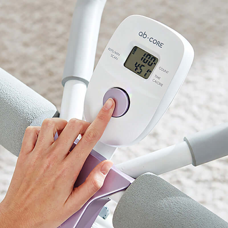 Woman using Core Glide Ab Trainer for core workouts at home